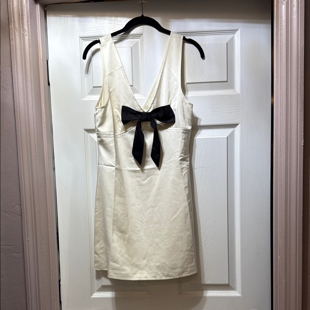 Elegant White Dress with Black Bow